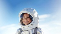 a photo of smiling girl child dressed as astronaut.  