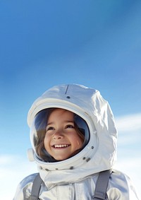 a photo of smiling girl child dressed as astronaut.  