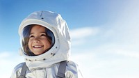 a photo of smiling girl child dressed as astronaut.  