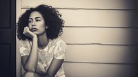 Authentic photo of mixed race woman is sitting and contemplating something. AI generated Image by rawpixel. 