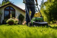 Photo of a man tending to lawn. 