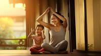 Photo of asia girl do yoga pose with her mom.  