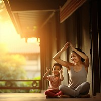 Photo of asia girl do yoga pose with her mom.  