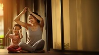 Photo of asia girl do yoga pose with her mom.  