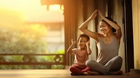 Photo of asia girl do yoga pose with her mom.  