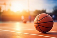 photo of Close-up of basketball on floor Field with Blurry Stadium in Background. 