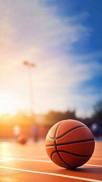 photo of Close-up of basketball on floor Field with Blurry Stadium in Background. 