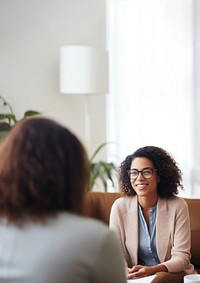 Photo of a psychologist talking to a man. 