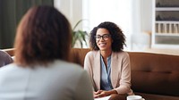 Photo of a psychologist talking to a man. 