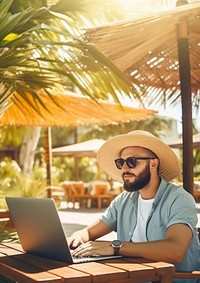 Young man freelancer traveler working online using laptop while traveling on summer vacation. 