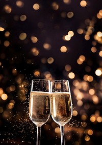 A photo of two champagne glasses with sparkling fireworks in the background. AI generated Image by rawpixel. 