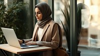 Woman working on laptop. 