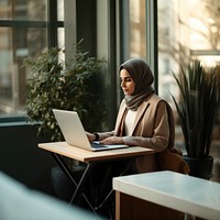 Woman working on laptop. 