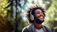 Happy man headphones listening outdoors.  