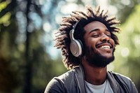 Happy man headphones listening outdoors.  