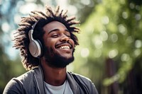 Happy man headphones listening outdoors.  