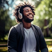 Happy man headphones listening outdoors.  