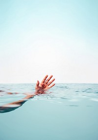 Waving hand in the ocean. 