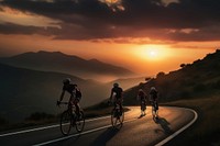 side view Photo of 3 man bicycling on the mountain road, sunset.  