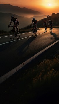 side view Photo of 3 man bicycling on the mountain road, sunset.  