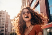 Woman having fun laughing outdoors glasses. 