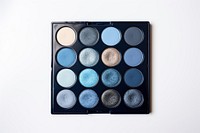 Blue eyeshadow palette cosmetics white background arrangement. 