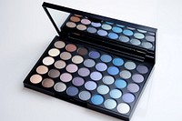 Blue eyeshadow palette cosmetics arrangement electronics. 