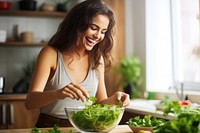 Woman mixing bowl salad adult happy. 