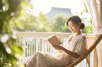 Reading sitting adult woman. 