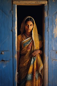 Standing adult woman sari. 