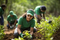 Volunteers gardening planting outdoors. 