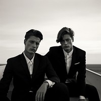 Two men wearing formal style photography portrait fashion. AI generated Image by rawpixel.