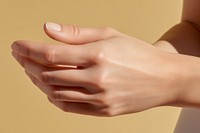 Woman applying cream hand finger skin. 