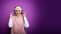 photo of a muslim woman wearing headphones.  