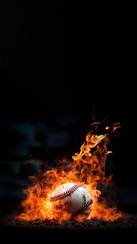 Photo of close up shot of a baseball on fire.  