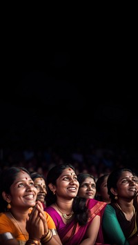 Photography of Unusual looking 36yo south Indian women speacking watching concert.  