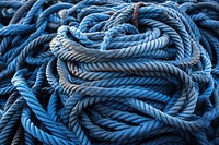 Pile of blue industrial rope fishing backgrounds durability.