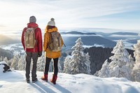 Rear of a Couple hikers with beautiful winter scene.  