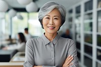 Middle aged asian short hair business woman smiling arms crossed adult retirement happiness. AI generated Image by rawpixel.