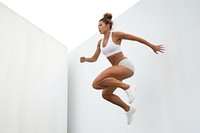 Jumping adult woman wall. AI generated Image by rawpixel.