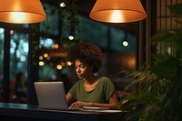 Black Young woman working laptop computer table. 