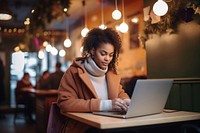 Black Young woman working laptop computer table. 