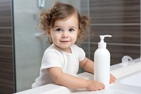 Shampoo pump bottle baby bathroom portrait. 