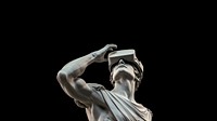 Greek God statue wearing VR glasses. 