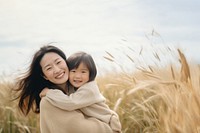 full body of Asian mother hug asian daughter. 