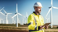 photo of Wind turbine worker useing tablet. 