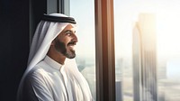 Photo of an Arabic businessman looking out of a window. AI generated Image by rawpixel.