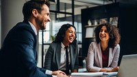 Photo of office workers laughing in the meeting room. 