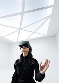 South-East asian girl playing VR game wearing all black outfit. AI generated Image by rawpixel.