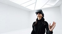 South-East asian girl playing VR game wearing all black outfit. AI generated Image by rawpixel.